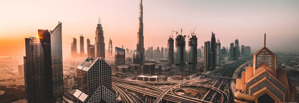 Dubai skyline at sunset with Burj Khalifa and surrounding real estate
