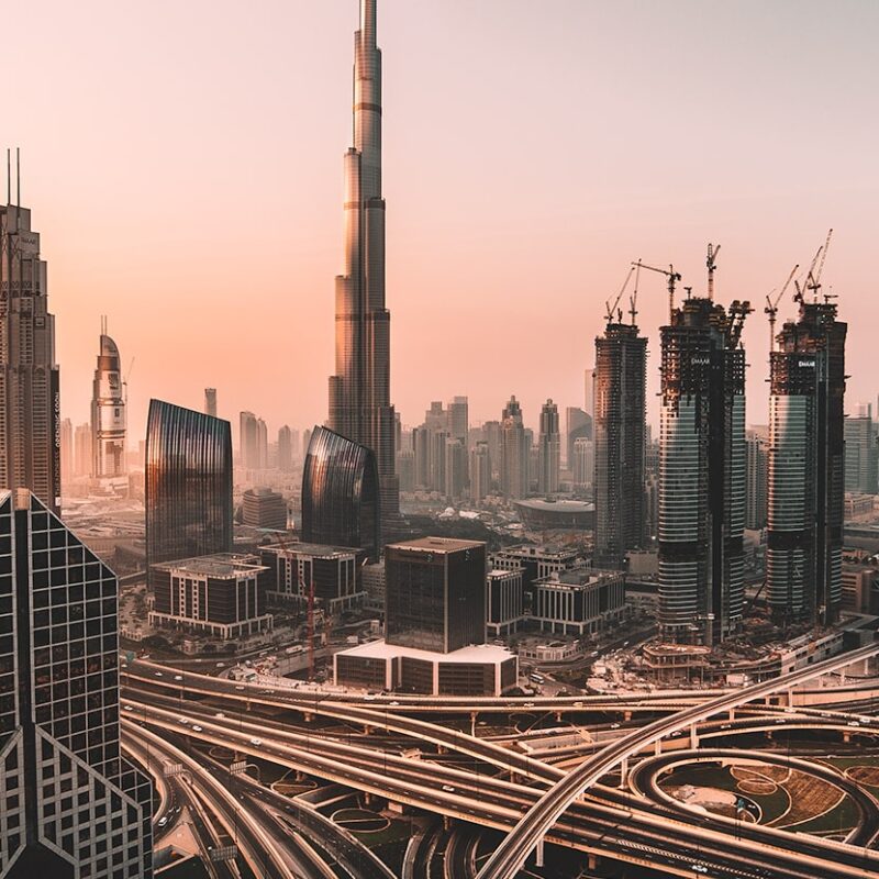 Dubai skyline at sunset with Burj Khalifa and surrounding real estate
